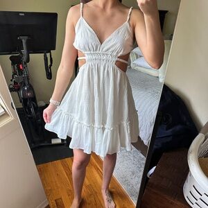 High flier open back white mini dress